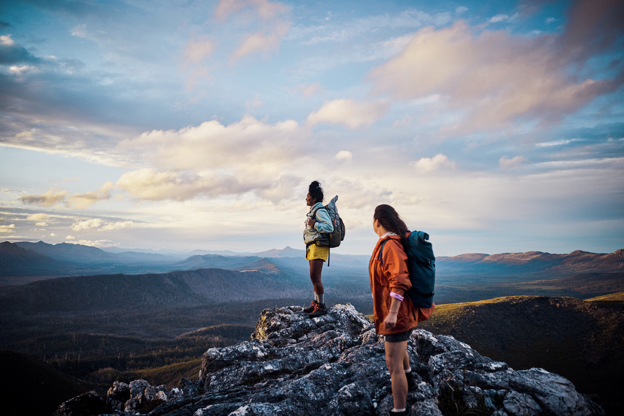 Women hikers embracing the untamed beauty of Tasmania through exhilarating bushwalking.